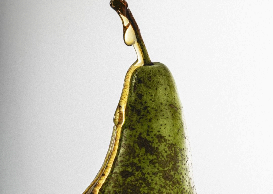 Artistic pear with honey dripping