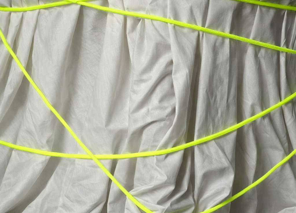 White fabric with neon yellow threads
