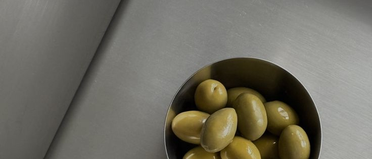 Olives on steel surface